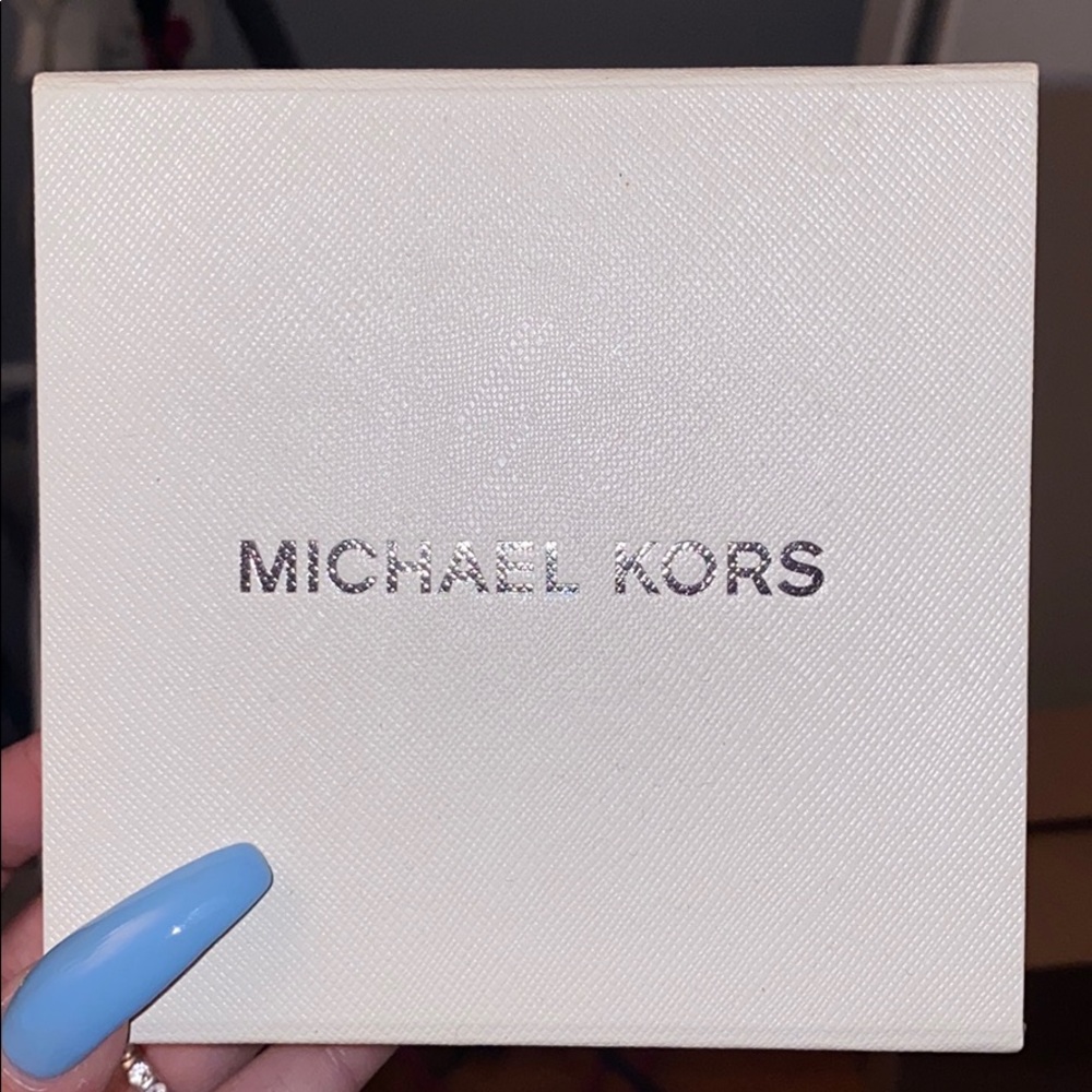 Brand new Michael Kors rose gold earrings.
